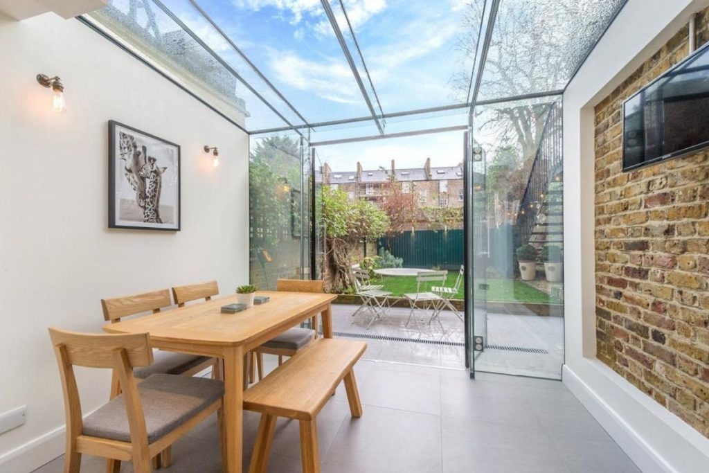 A small but perfectly formed dining room in a glass box extension