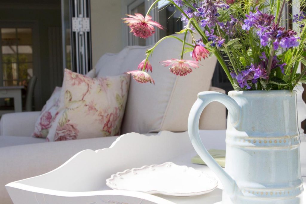 The sun filled orangery interior offers a tranquil space to relax in