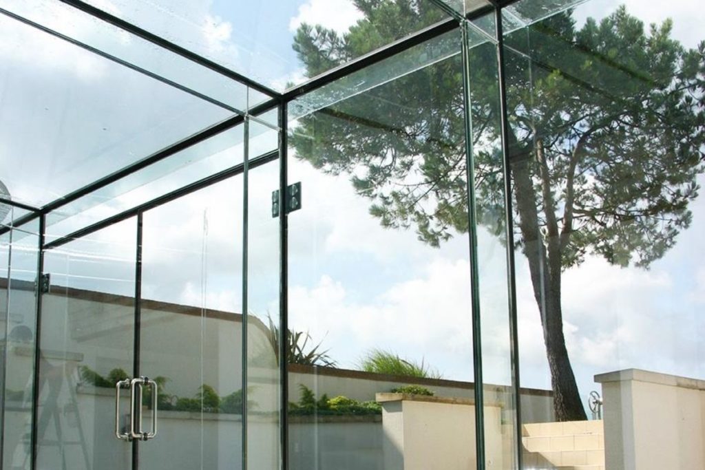 Stunning glass box extension with a flat glass roof