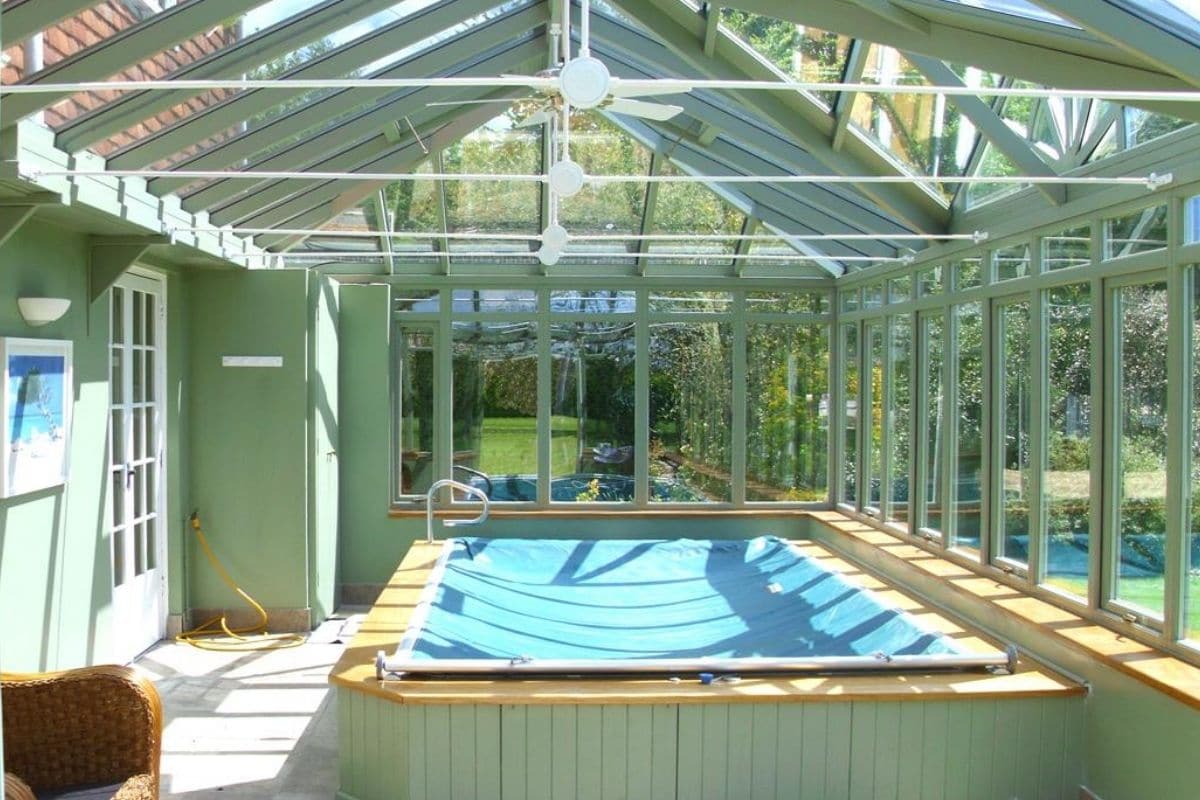 Sage green timber framed pool house conservatory