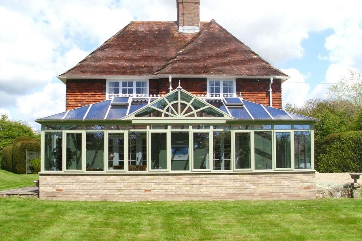 External sage green timber framed pool house conservatory