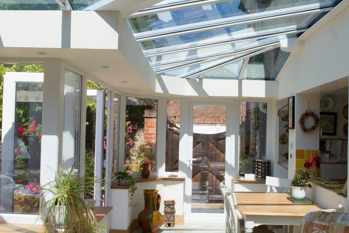uPVC lean-to orangery with room for dinning opening up to a larger dome sitting area