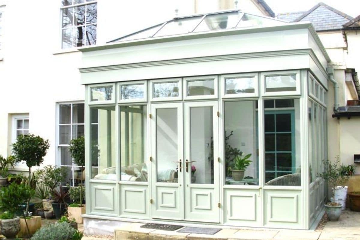 Timber green painted orangery