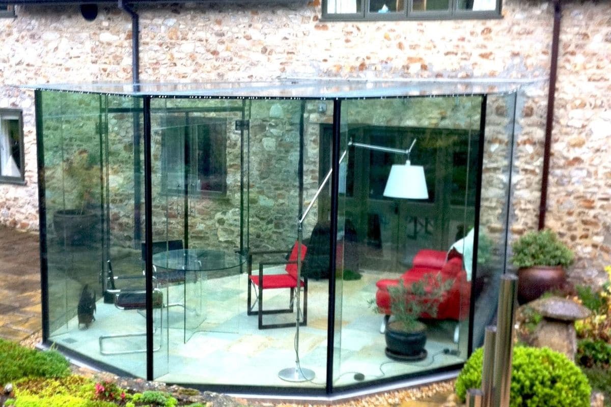Hexagon frameless glass box garden room
