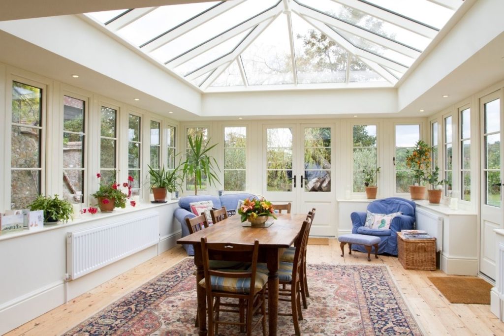 Large orangery with a full coverage lantern roof.
