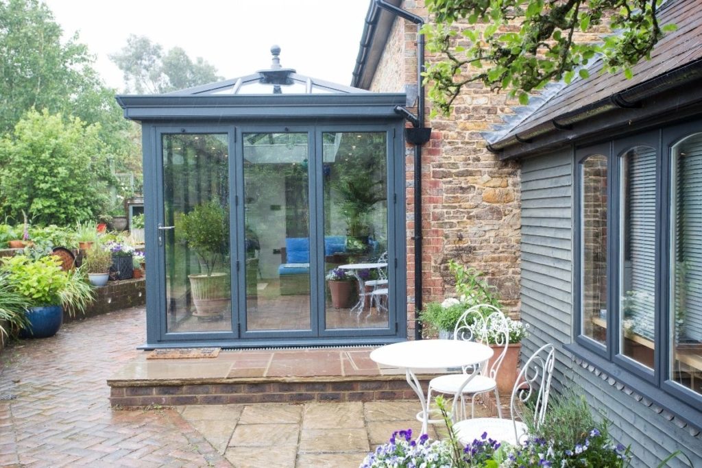 Aluminium orangery with bi-fold doors