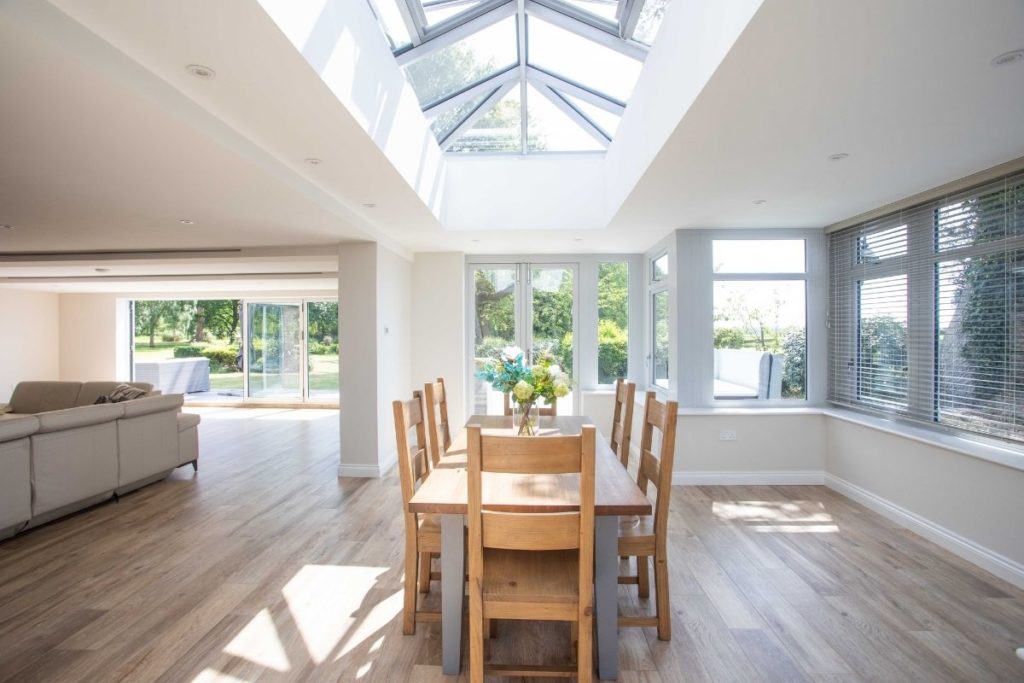 Large open plan living dining orangery extension with full glass lantern roof