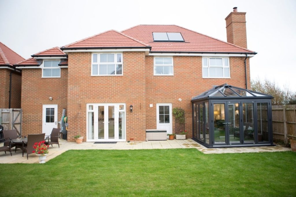 Grey uPVC Conservatory Extension on a modern new build home