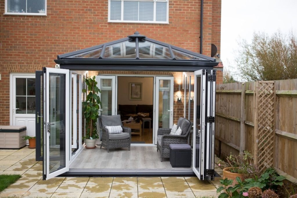 Dark grey uPVC framed conservatory with contrasting white internal frames