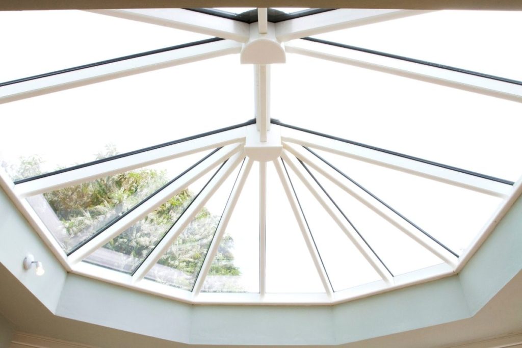 Large orangery lantern roof with temperature control glass to to keep the glass room warmer for longer