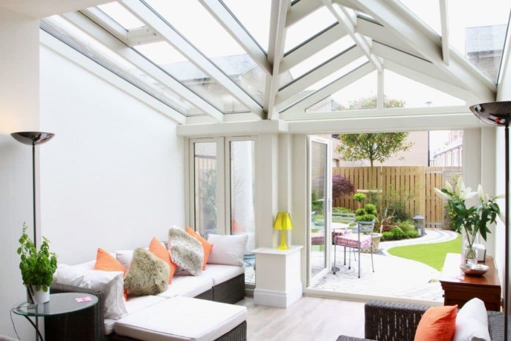 Full glass conservatory roof over a lounge dinner glass extension