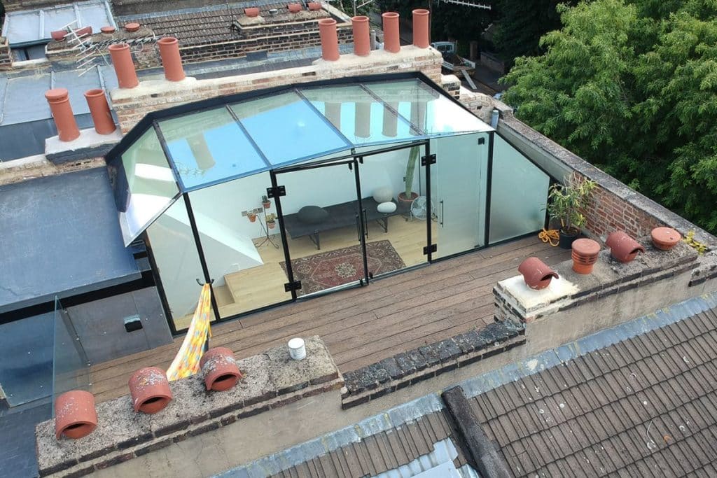 Frameless glass roof terrace extension