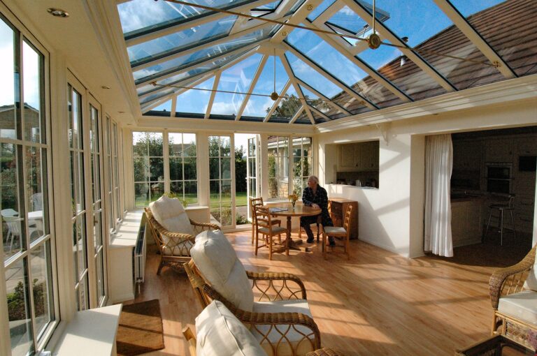 Inside conservatory extension with man