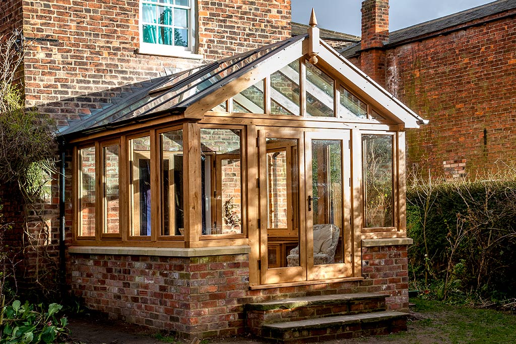 Contemporary glazed extension with bifold doors opening towards the garden