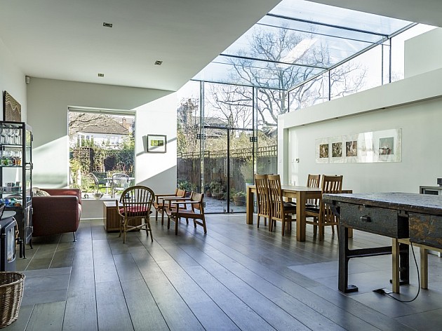 Open-plan kitchen living space with glass roof extension